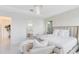 Bright bedroom featuring a large bed, natural light, and neutral decor at 1675 Amsel Falls Park Ter, Winter Garden, FL 34787