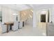 Elegant dining room featuring a wood table, white chairs, modern chandelier, and decorative wall at 1675 Amsel Falls Park Ter, Winter Garden, FL 34787