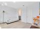 Bright living room with white sofa, hardwood floors, and access to a bathroom at 1675 Amsel Falls Park Ter, Winter Garden, FL 34787