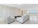 Spacious loft featuring a comfortable seating area and beautiful white trim throughout the room at 1675 Amsel Falls Park Ter, Winter Garden, FL 34787