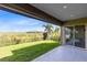 Inviting patio with a view of the green lawn and beautiful landscape at 1675 Amsel Falls Park Ter, Winter Garden, FL 34787