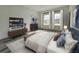 Cozy bedroom featuring a large bed, ample natural light, and modern furnishings at 17167 Sw 40 Ter, Ocala, FL 34473