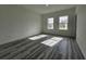Bright and spacious bedroom with wood-look flooring and dual windows offering ample natural light at 17167 Sw 40 Ter, Ocala, FL 34473