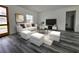 Bright living room with white furnishings, modern decor, and a view to the outside at 17167 Sw 40 Ter, Ocala, FL 34473