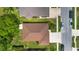 Aerial view of a home featuring a well maintained lawn and mature landscaping at 1842 Turnbull Lakes Dr, New Smyrna Beach, FL 32168