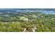 Wonderful aerial view overlooking the lake, golf course, and community, offering a serene and picturesque residential setting at 1842 Turnbull Lakes Dr, New Smyrna Beach, FL 32168