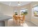 Dining area with breakfast table, bright light, and a large window bringing the outdoors in at 1842 Turnbull Lakes Dr, New Smyrna Beach, FL 32168