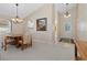Inviting dining area adjacent to the entryway, illuminated by a chandelier at 1842 Turnbull Lakes Dr, New Smyrna Beach, FL 32168