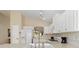 Bright kitchen featuring white cabinets, modern appliances, and natural light, creating a functional and inviting space at 1842 Turnbull Lakes Dr, New Smyrna Beach, FL 32168