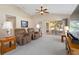 Comfortable living area with plush seating and slider doors leading to a screened patio at 1842 Turnbull Lakes Dr, New Smyrna Beach, FL 32168