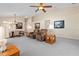 A generously sized room with a ceiling fan, and furnishings at 1842 Turnbull Lakes Dr, New Smyrna Beach, FL 32168