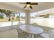 This patio features large windows and an overhead fan for comfort at 1842 Turnbull Lakes Dr, New Smyrna Beach, FL 32168