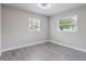 Well-lit bedroom featuring neutral walls, modern lighting, and new vinyl flooring at 2113 Winnetka Ct, Orlando, FL 32818