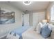 Comfortable bedroom with a fan, soft bedding, a painting and lots of natural light at 2113 Winnetka Ct, Orlando, FL 32818
