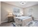 Serene bedroom with two windows, a soft rug and two nightstands with lamps at 2113 Winnetka Ct, Orlando, FL 32818