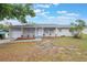 Charming single-story home with a well-maintained lawn and inviting front porch at 2113 Winnetka Ct, Orlando, FL 32818