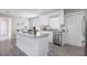 Stylish kitchen featuring granite countertops, stainless steel appliances and luxury vinyl flooring at 2113 Winnetka Ct, Orlando, FL 32818