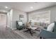 Comfortable living room with luxury flooring and large window provides plenty of natural light at 2113 Winnetka Ct, Orlando, FL 32818