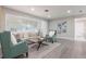 Bright living room featuring luxury flooring, a large window and tastefully curated furniture at 2113 Winnetka Ct, Orlando, FL 32818