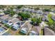Real estate view of community homes featuring screened patios, solar panels, well-manicured lawns and landscaping at 217 Herring St, Davenport, FL 33897