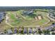 Real estate aerial view of homes surrounded by golf course and lush landscaping at 217 Herring St, Davenport, FL 33897