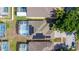 Aerial shot of a house featuring a pool, solar panels, and a screened-in patio at 217 Herring St, Davenport, FL 33897