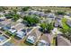 Real estate view of community homes featuring screened patios, solar panels, well-manicured lawns and landscaping at 217 Herring St, Davenport, FL 33897