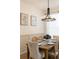 Elegant dining room featuring a stylish chandelier and seating for six guests at 217 Herring St, Davenport, FL 33897