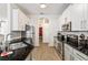 Bright kitchen with stainless steel appliances, granite counters, and modern cabinetry at 217 Herring St, Davenport, FL 33897