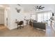 Open concept living room with modern furnishings, a ceiling fan, and hardwood flooring throughout at 217 Herring St, Davenport, FL 33897