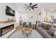 Open living space with a fireplace, a mounted television, and stylish furnishings at 217 Herring St, Davenport, FL 33897