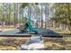 Community playground featuring a slide and play equipment, surrounded by trees, perfect for outdoor fun at 217 Herring St, Davenport, FL 33897