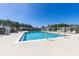 Enjoy a refreshing swim in this community pool, surrounded by sun loungers and a privacy fence at 217 Herring St, Davenport, FL 33897