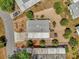 Birds eye view showcasing the property's roof and surrounding landscaped gravel yard at 220 Palmer Park Ln, Davenport, FL 33897