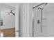 Clean bathroom with enclosed shower and white cabinets at 220 Palmer Park Ln, Davenport, FL 33897