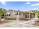 Charming single-story home with covered carport and inviting curb appeal at 220 Palmer Park Ln, Davenport, FL 33897