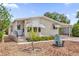 Charming single-story home featuring well-maintained landscaping and a cozy front porch at 220 Palmer Park Ln, Davenport, FL 33897