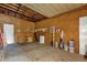 Unfinished garage providing ample storage and workspace at 220 Palmer Park Ln, Davenport, FL 33897