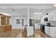 Modern kitchen featuring sleek black appliances, granite countertops, and white cabinetry at 220 Palmer Park Ln, Davenport, FL 33897