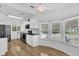 Bright and airy kitchen with stainless steel appliances, white cabinets, and natural lighting at 220 Palmer Park Ln, Davenport, FL 33897