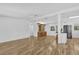 Spacious living area with hardwood floors connecting the kitchen and an oak hutch in the corner at 220 Palmer Park Ln, Davenport, FL 33897