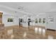 Bright and airy living area with hardwood floors, and modern kitchen with ample natural light at 220 Palmer Park Ln, Davenport, FL 33897