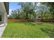 A large grassy backyard, fenced for privacy, provides plenty of space for outdoor activities at 2306 Hargill Dr, Orlando, FL 32806