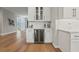 Stylish bar area with built-in wine cooler and glass-front cabinets, perfect for entertaining at 2306 Hargill Dr, Orlando, FL 32806