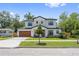 Beautiful two-story home with modern wood garage door and manicured front yard at 2306 Hargill Dr, Orlando, FL 32806