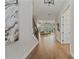 Spacious foyer with hardwood floors, staircase, and views into the living area at 2306 Hargill Dr, Orlando, FL 32806