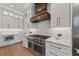 Modern kitchen with white cabinets, stainless steel appliances, and a decorative backsplash at 2306 Hargill Dr, Orlando, FL 32806