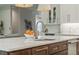Kitchen island with marble countertop, sink, and stainless steel dishwasher at 2306 Hargill Dr, Orlando, FL 32806