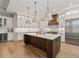 Bright and airy kitchen with a large island, stainless steel appliances, and hardwood floors at 2306 Hargill Dr, Orlando, FL 32806