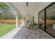 Covered patio with an outdoor kitchen, ceiling fan, and tiled floors, ideal for entertaining at 2306 Hargill Dr, Orlando, FL 32806
